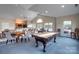 Community game room with billiard table and seating for socializing at 874 Ledgestone Ct, Tega Cay, SC 29708