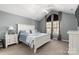 Spacious bedroom with vaulted ceiling and a large bed at 874 Ledgestone Ct, Tega Cay, SC 29708