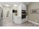 Kitchen with white cabinets, double wall oven, and built-in microwave at 874 Ledgestone Ct, Tega Cay, SC 29708