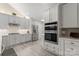 Modern kitchen with stainless steel appliances and white shaker cabinets at 874 Ledgestone Ct, Tega Cay, SC 29708