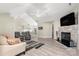 Open living room with hardwood floors and fireplace at 874 Ledgestone Ct, Tega Cay, SC 29708