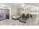 Living Room with kitchen view and hardwood floors at 874 Ledgestone Ct, Tega Cay, SC 29708