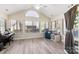 Sunroom with hardwood floors and plenty of natural light at 874 Ledgestone Ct, Tega Cay, SC 29708