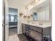 Double vanity bathroom with a large mirror and view of bedroom at 970 Bunker Trce, Rock Hill, SC 29730