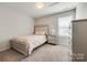 Bright bedroom with plush carpeting and built-in storage at 970 Bunker Trce, Rock Hill, SC 29730