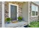 Modern dark gray front door flanked by stonework and greenery at 970 Bunker Trce, Rock Hill, SC 29730