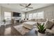 Living room features sectional sofa, large TV, and hardwood floors at 970 Bunker Trce, Rock Hill, SC 29730