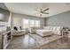 Spacious living room with L-shaped sectional sofa and ceiling fan at 970 Bunker Trce, Rock Hill, SC 29730