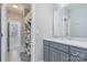 Grey vanity and shower in secondary bathroom at 9929 Allyson Park Dr, Charlotte, NC 28277