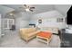 Large bedroom with sitting area and ample natural light at 9929 Allyson Park Dr, Charlotte, NC 28277