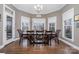 Kitchen breakfast nook with bay windows and a wooden table at 9929 Allyson Park Dr, Charlotte, NC 28277