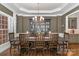 Formal dining room with a large table and built-in hutch at 9929 Allyson Park Dr, Charlotte, NC 28277