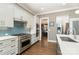 Spacious kitchen featuring white cabinets, stainless steel appliances, and an island at 9929 Allyson Park Dr, Charlotte, NC 28277