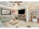 Open living room with hardwood floors and built-in shelving at 9929 Allyson Park Dr, Charlotte, NC 28277