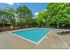 Inviting community pool with plenty of lounge chairs at 9929 Allyson Park Dr, Charlotte, NC 28277