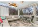 Relaxing screened porch with comfortable seating and a view of the backyard at 9929 Allyson Park Dr, Charlotte, NC 28277