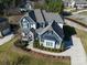 Stunning two-story house, gray siding, stone accents, and a large yard at 100 S Centurion Ln, Mount Holly, NC 28120