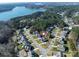 Aerial view of house and neighborhood; desirable location, lake nearby at 100 S Centurion Ln, Mount Holly, NC 28120