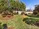 Landscaped backyard with lush greenery at 100 S Centurion Ln, Mount Holly, NC 28120