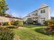 Landscaped backyard with expansive lawn at 100 S Centurion Ln, Mount Holly, NC 28120