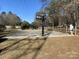 Outdoor basketball court with two hoops at 100 S Centurion Ln, Mount Holly, NC 28120