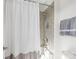 Clean bathroom with shower/tub combo and white curtain at 100 S Centurion Ln, Mount Holly, NC 28120