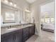 Double vanity bathroom with granite countertop at 100 S Centurion Ln, Mount Holly, NC 28120