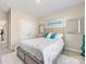 Comfortable bedroom with plush bed and large window at 100 S Centurion Ln, Mount Holly, NC 28120