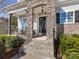 Stone pillars frame the front door entrance with a porch and steps at 100 S Centurion Ln, Mount Holly, NC 28120