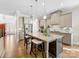 Modern kitchen with an island, stainless steel appliances, and granite countertops at 100 S Centurion Ln, Mount Holly, NC 28120