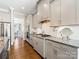 Modern kitchen with light cabinets, granite countertops, and stainless steel appliances at 100 S Centurion Ln, Mount Holly, NC 28120