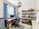 Home office with built-in shelving and a workspace at 100 S Centurion Ln, Mount Holly, NC 28120