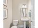 Elegant powder room with pedestal sink, and stylish wall art at 100 S Centurion Ln, Mount Holly, NC 28120