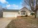 House exterior with garage and landscaping at 1002 Joanne Ct, Kings Mountain, NC 28086