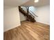 Basement featuring wood stairs and vinyl floors at 1003 W 4Th Ave, Gastonia, NC 28052