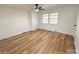 Bright bedroom with a ceiling fan, vinyl floors, and a window providing great natural light at 1003 W 4Th Ave, Gastonia, NC 28052