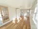 Bright bedroom with wood-look vinyl flooring, a ceiling fan, and a closet for extra storage at 1003 W 4Th Ave, Gastonia, NC 28052