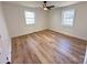 Bright bedroom with a ceiling fan, vinyl floors, and two windows providing great natural light at 1003 W 4Th Ave, Gastonia, NC 28052