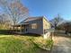 Single-Gathering home with gray shingle siding and covered porch at 1003 W 4Th Ave, Gastonia, NC 28052