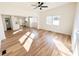 Open concept living room with luxury vinyl floors, a ceiling fan, and plenty of natural light at 1003 W 4Th Ave, Gastonia, NC 28052