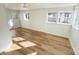 Bright living room with vinyl floor, multiple windows providing great natural light, and access to the outside at 1003 W 4Th Ave, Gastonia, NC 28052