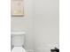 Simple powder room with a toilet and a small sink at 10517 S Hampton Dr, Charlotte, NC 28227