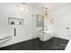 Modern bathroom with soaking tub and walk-in shower at 10517 S Hampton Dr, Charlotte, NC 28227