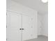 Empty bedroom with double doors and grey carpet at 10517 S Hampton Dr, Charlotte, NC 28227