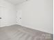 Empty bedroom with grey carpet and white walls at 10517 S Hampton Dr, Charlotte, NC 28227