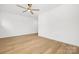 Bright bedroom with hardwood floors and ceiling fan at 10517 S Hampton Dr, Charlotte, NC 28227