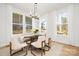 Bright dining area with hardwood floors and large windows at 10517 S Hampton Dr, Charlotte, NC 28227