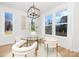 Modern dining room with glass table and large windows at 10517 S Hampton Dr, Charlotte, NC 28227