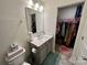 Bathroom with vanity, toilet, and walk-in closet at 11005 Woodland Creek Way, Charlotte, NC 28262