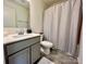 Bathroom with tub, vanity, and shower curtain at 11005 Woodland Creek Way, Charlotte, NC 28262